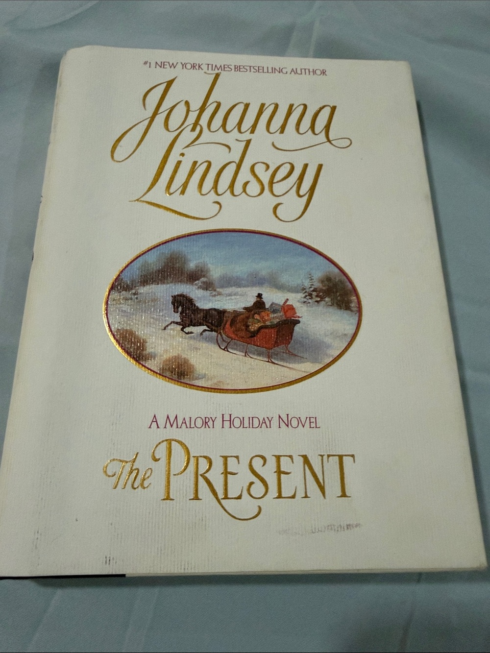 Hardcover Book with White Dust Jacket and Gold Accents